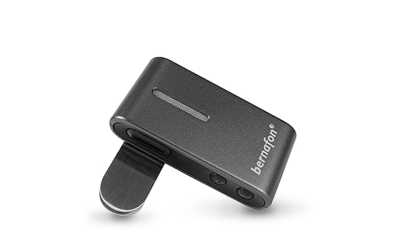 The Bernafon SoundClip-A is a compact, rectangular black device with a clip and two side buttons, branded with 